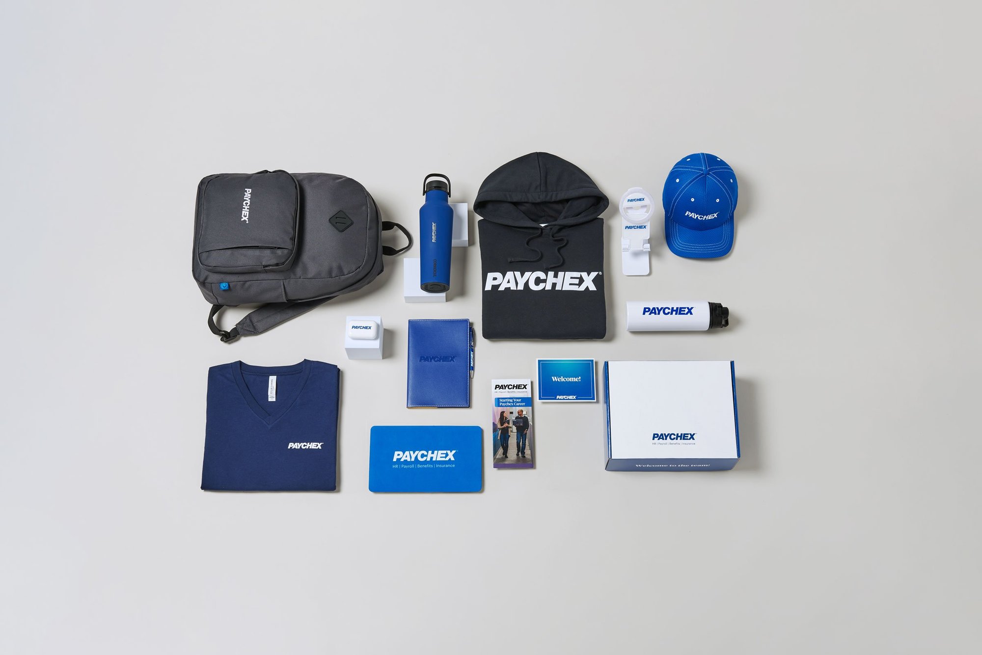 Paychex brandend book sack, shirts, bottles, hat and other merch.